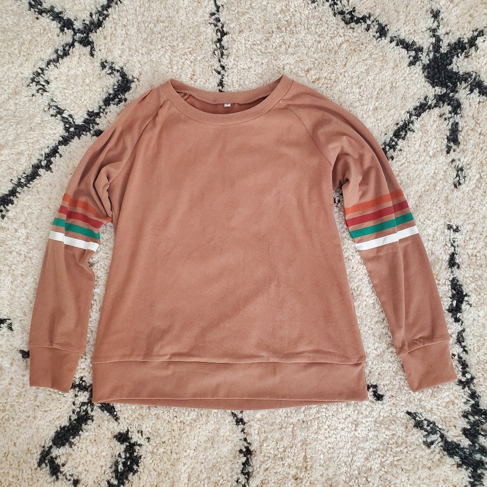 Light brown sweater with striped sleeves